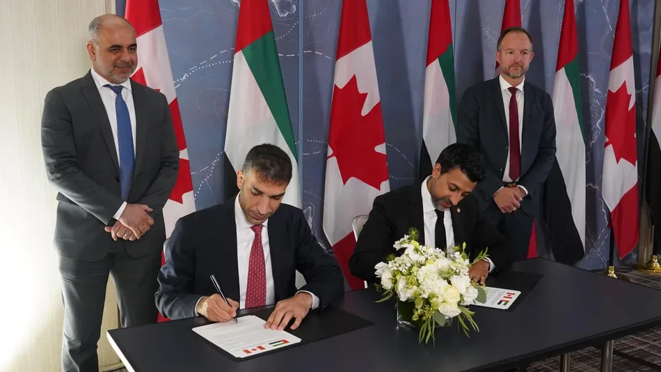 His Excellency Dr. Thani bin Ahmed Al Zeyoudi, UAE Minister of Foreign Trade, and the Honourable Maninder Sidhu, Canadian Minister of International Trade, signs the agreement. Image Courtesy: UAE Ministry of Foreign Trade