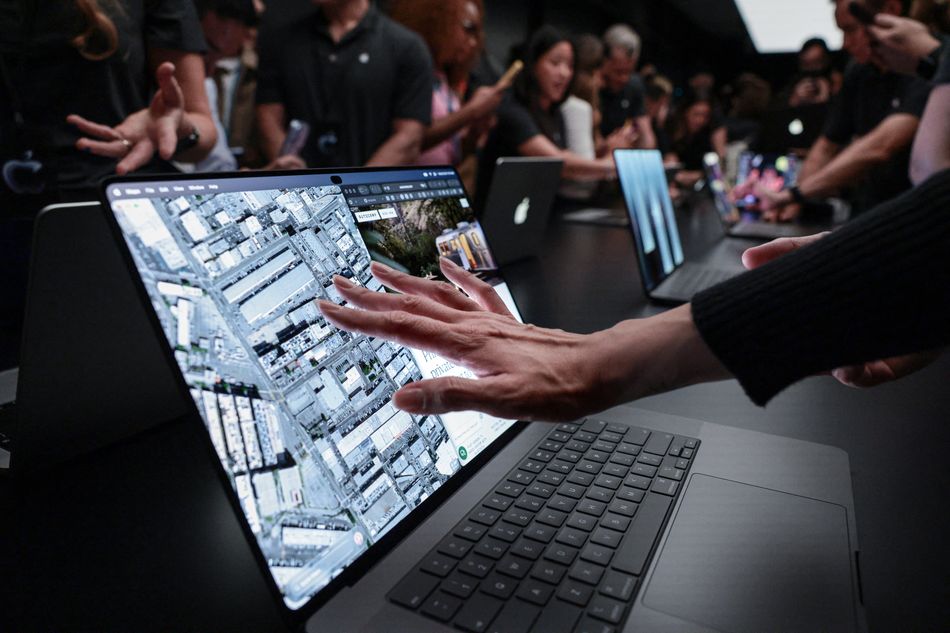 Apple shows pricey touchscreen laptops, a first for the iPhone maker ...