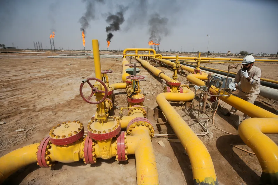 FILE PHOTO: A worker checks an oil pipeline at Nahr Bin Umar oil field, north of Basra, Iraq March 22, 2022. Image used for illustrative purpose. REUTERS/Essam Al-Sudani.
